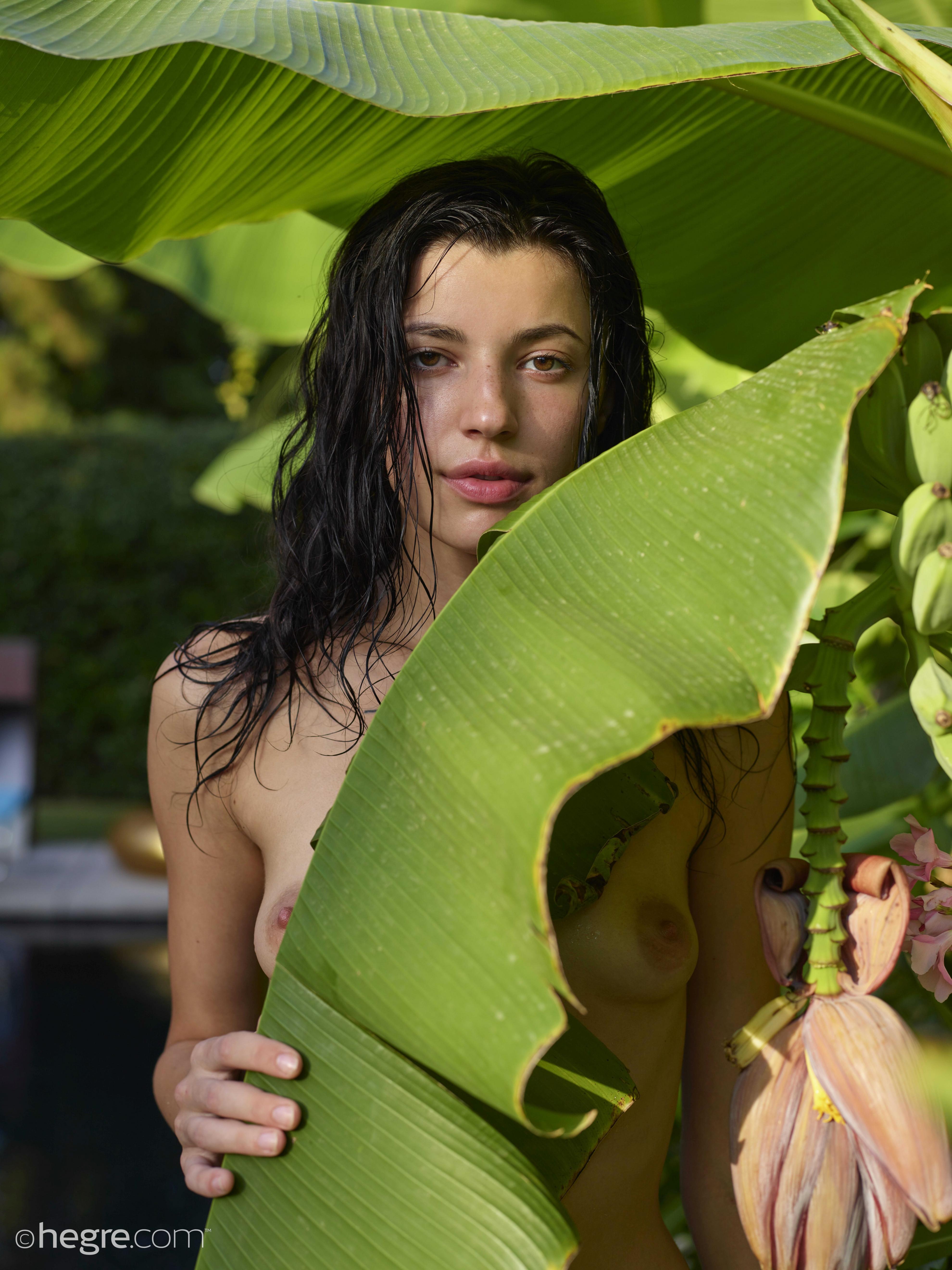 Oksi will blow your mind while posing naked by the pool  in Hegre Art set Luscious