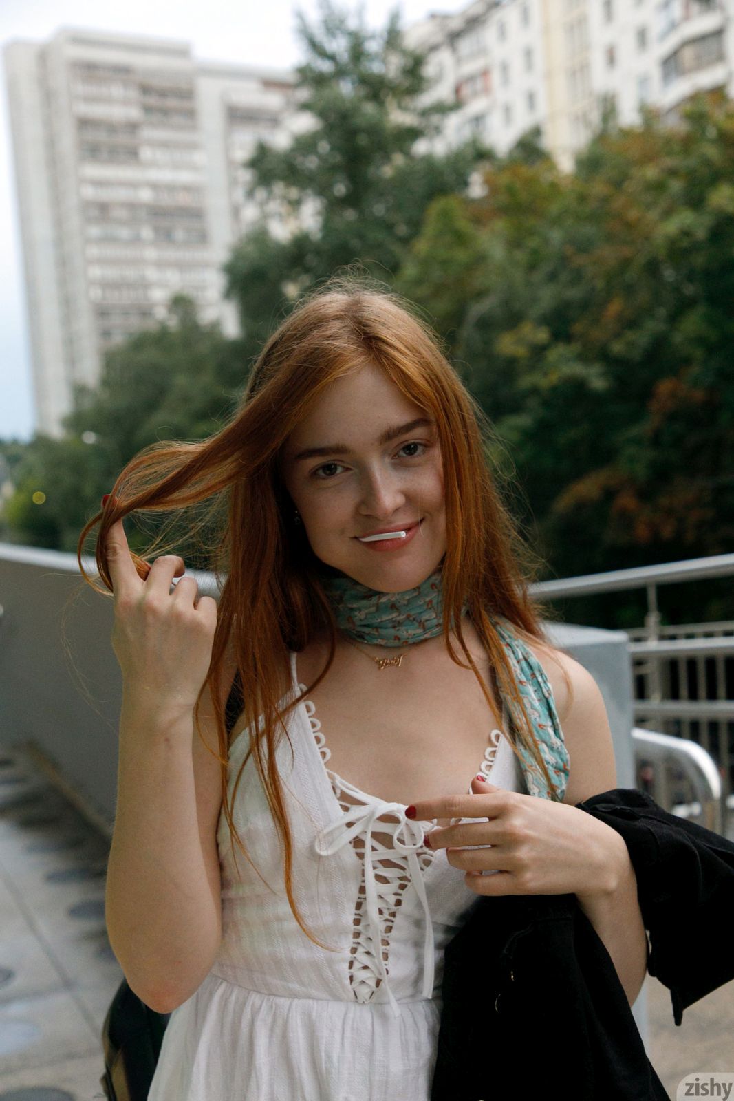 Pretty and playful redhead reveals her hot ass and small tits outdoor in public  in Zishy set The Russian Cinnabon