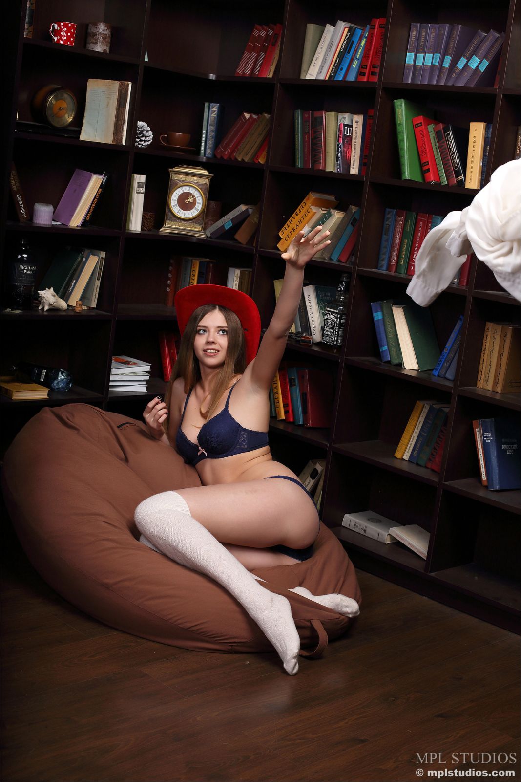 Supernatural brunette strips off her lingerie and starts hiding her yummy pussy with big red hat  in MPL Studios set Shhh In The Library