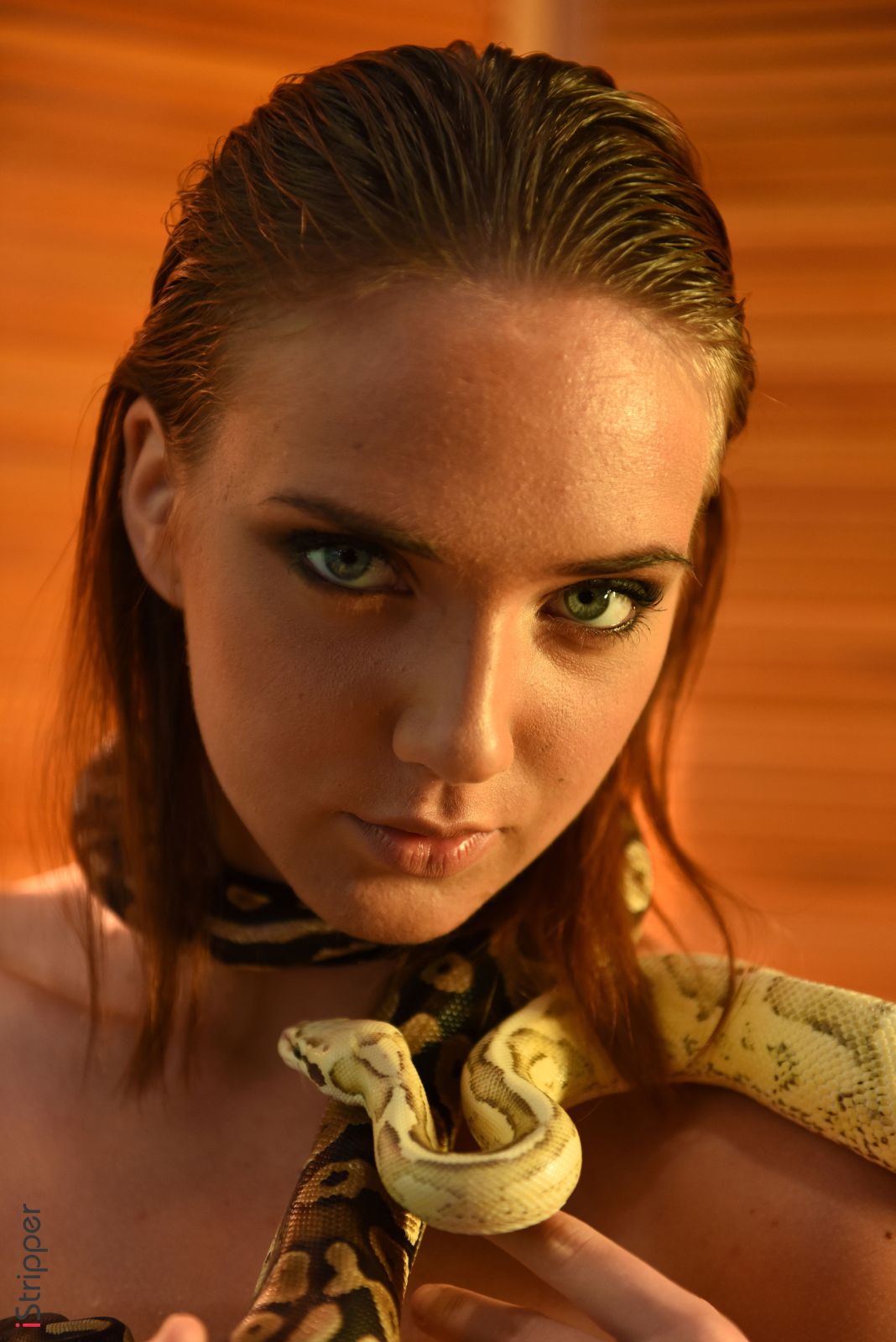 Oxana Chic a babe with blue eyes and hot curves is a queen of snakes  in Istripper set Snake Charmer