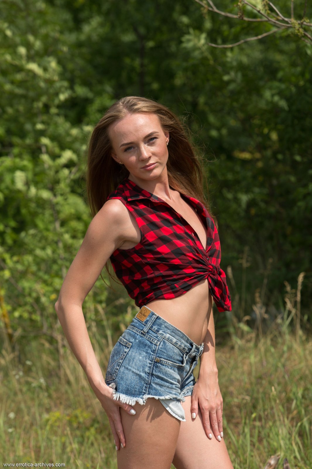 Adoring slim hottie Andrea Sixth takes off her plaid shirt and denim shorts outdoors in the woods  in Errotica Archives set Andrea Sixth