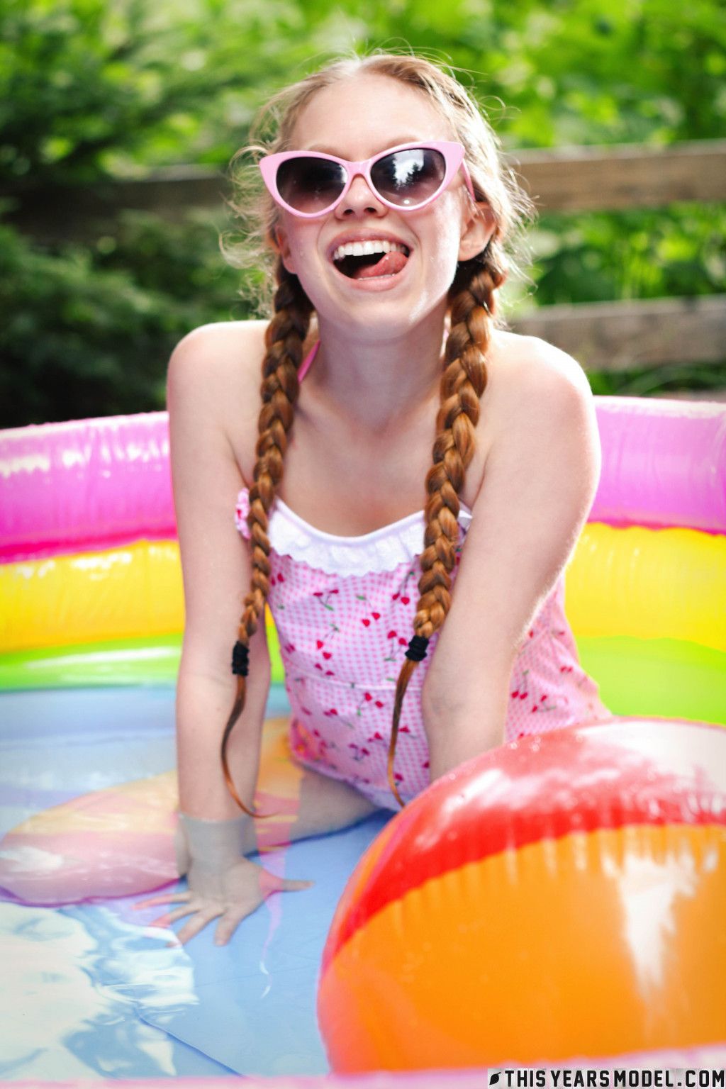 Playful girl Dolly Little is playing naked in the small pool showing off her skinny body  in This Years Model set Little Splash