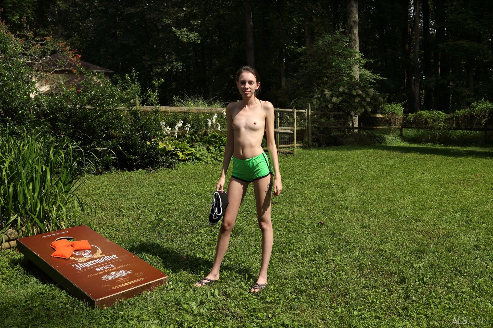 Skinny and flexible brunette Aria Haze having fun outdoors in the backyard  in Als Scan set Corn Hole