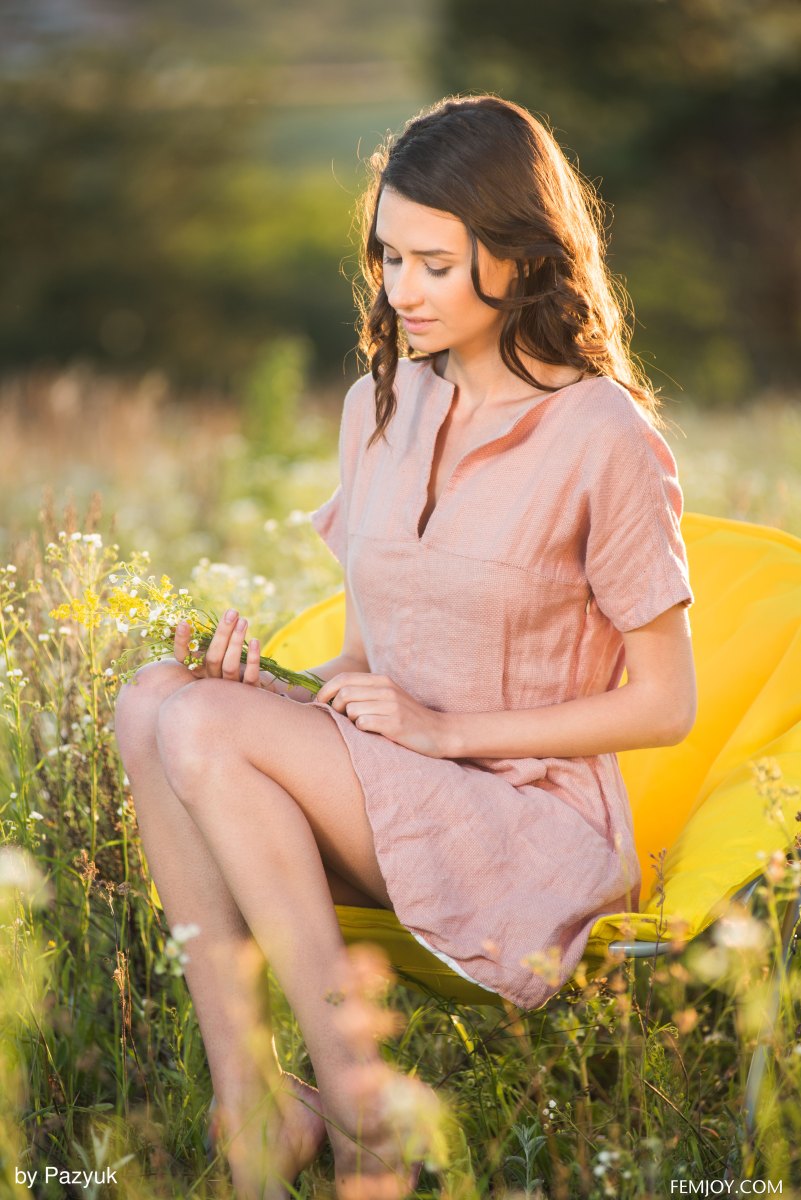 Sweet and charming babe Cristin M shows her assets outdoors in a meadow  in Femjoy set Summer Memories