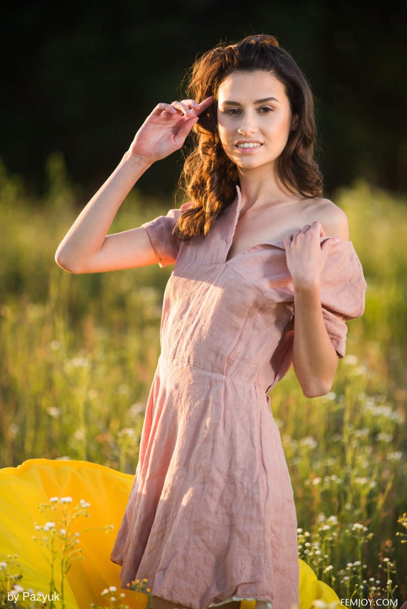 Sweet and charming babe Cristin M shows her assets outdoors in a meadow  in Femjoy set Summer Memories