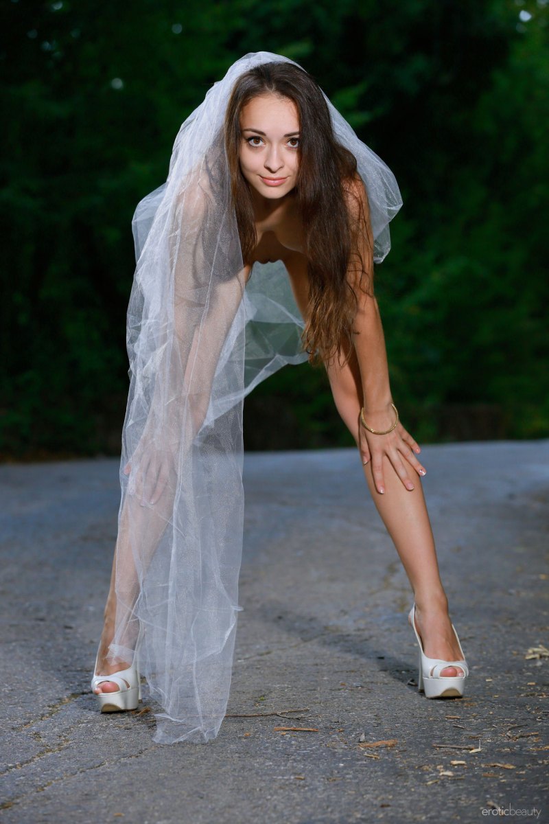 Fabulous brunette Chanel C sensually poses outdoors on the white lace  in Erotic Beauty set Having Fun