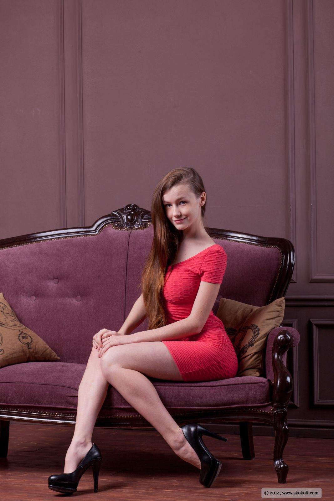 Emily Bloom a magnificent female teasing while posing in sexy tight red skirt  in Skokoff set Lady Vamp