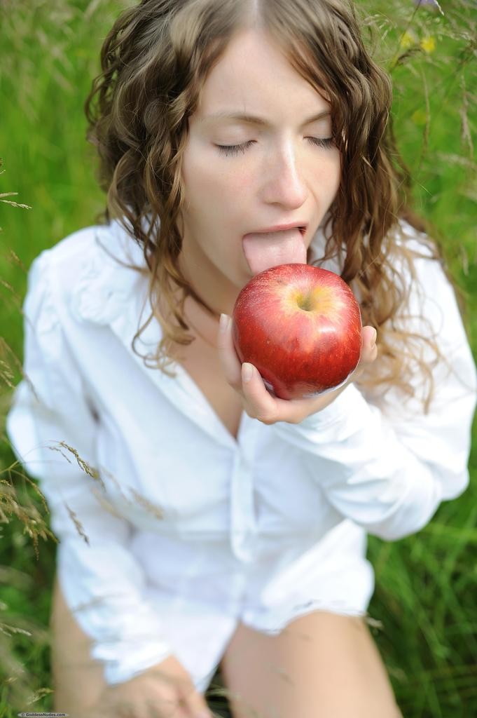 Ekitti leads you into temptation with open white peasant blouse and juicy apple