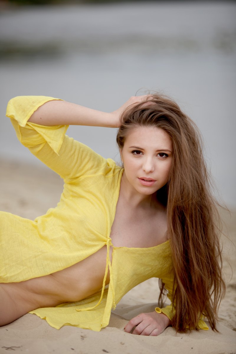 Cute and innocent looking girl is on the beach dressed only in yellow shirt  in Zemani set Members special