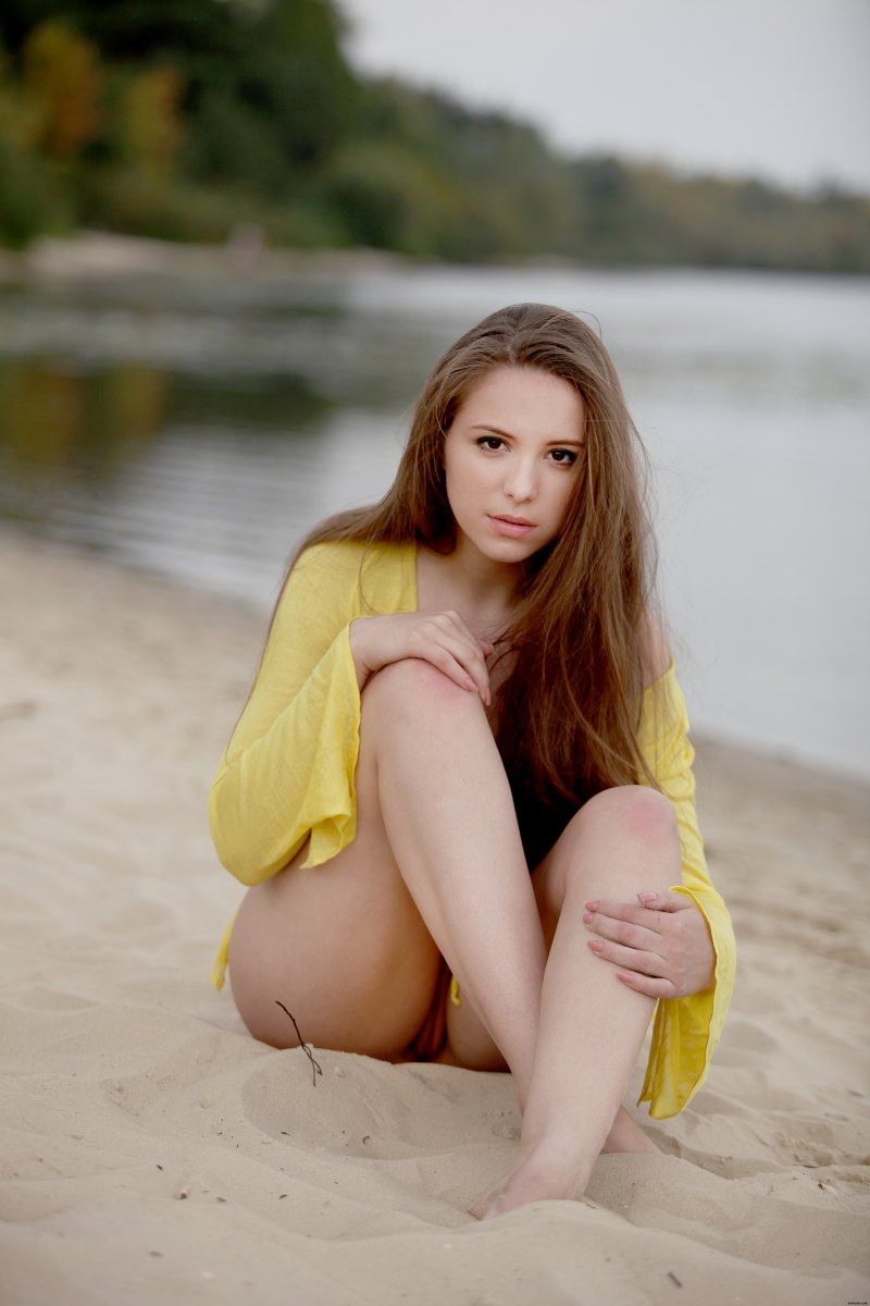 Cute and innocent looking girl is on the beach dressed only in yellow shirt  in Zemani set Members special