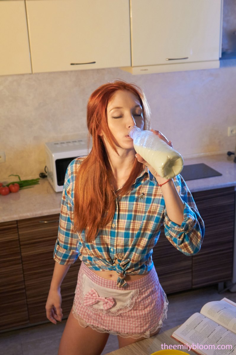 Ginger chick lets us see her slender body in amazing posing action in the kitchen  in The Emily Bloom set Cooking