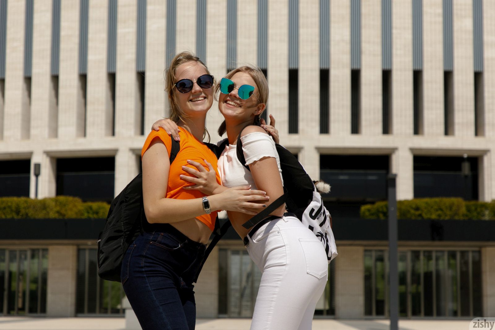 Busty brunette Diana and her blonde friend Victoria teasing with their attributes in public  in Zishy set World Cups