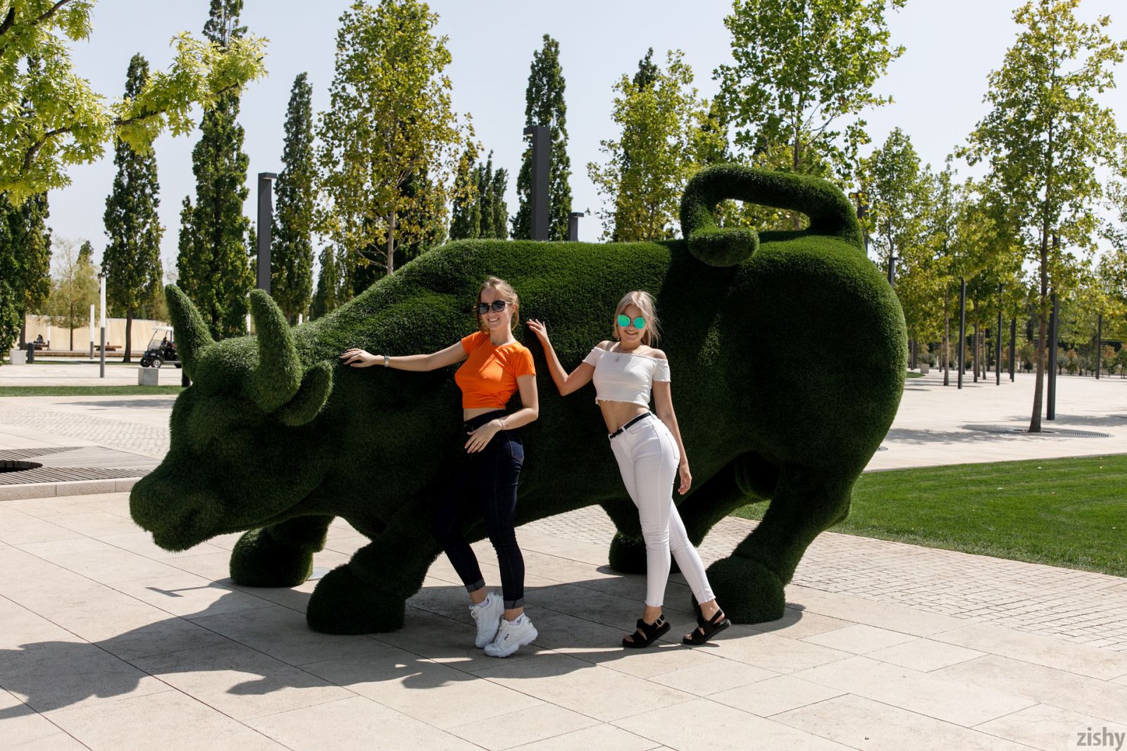 Busty brunette Diana and her blonde friend Victoria teasing with their attributes in public  in Zishy set World Cups