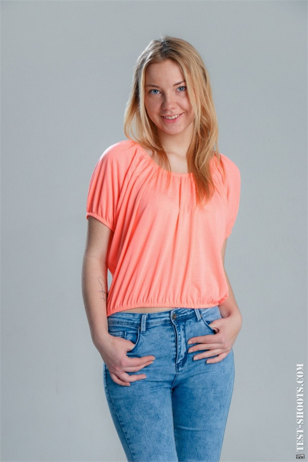 Girl with blue eyes takes off her jeans and orange tshirt only for us  in Test Shoots set Casting