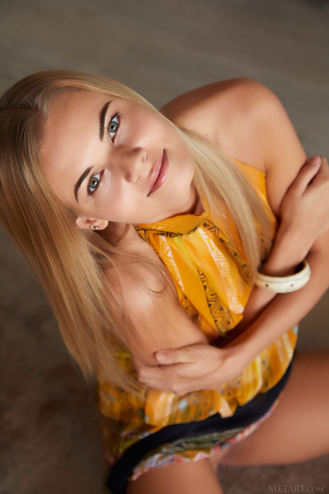 Delightful tanned blonde takes off her yellow dress baring her smooth slender body  in Metart set Loft Styles