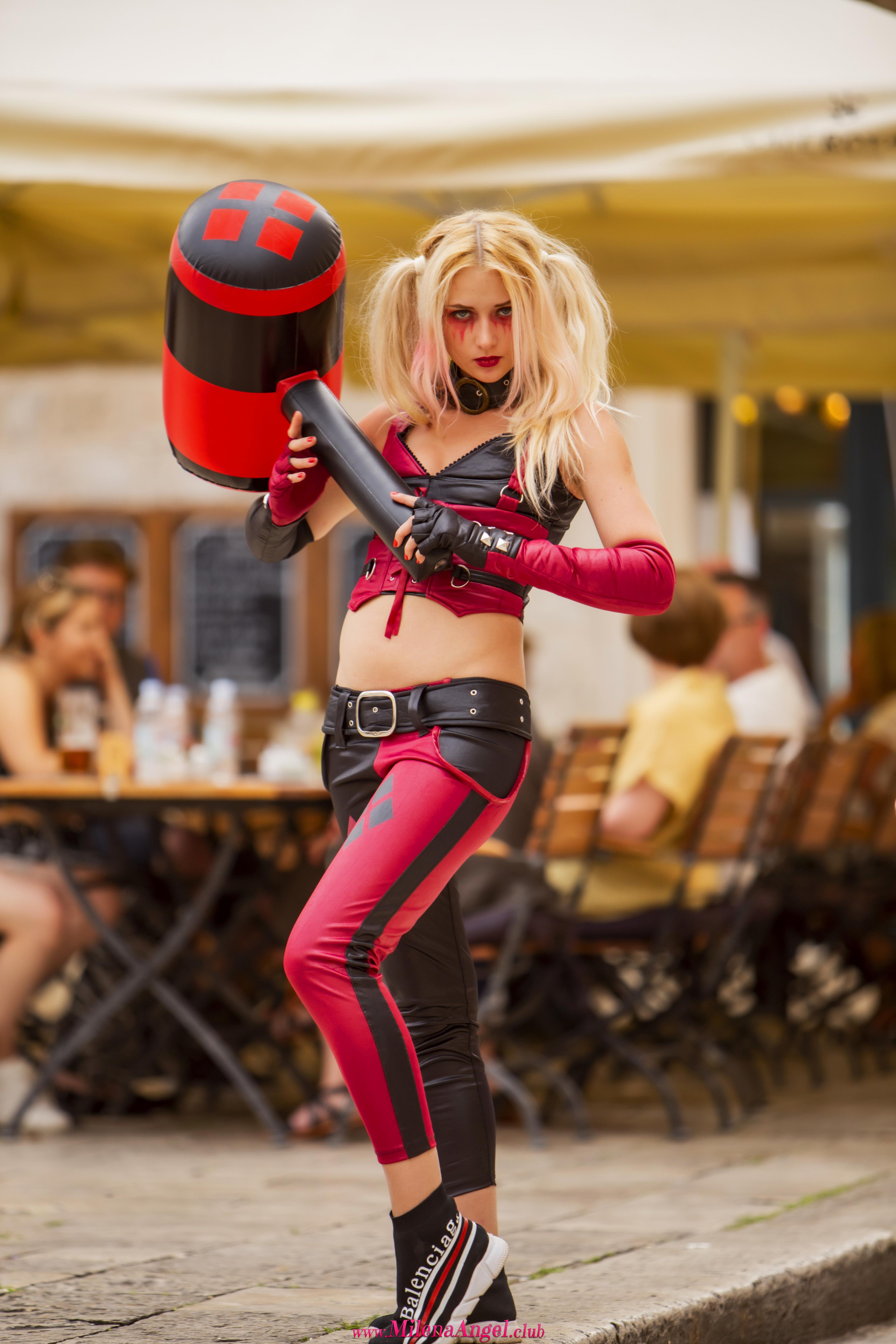 Adventurous blondie attractively poses through the city while wearing Harley Quinn costume  in Milena Angel set HQ Candid