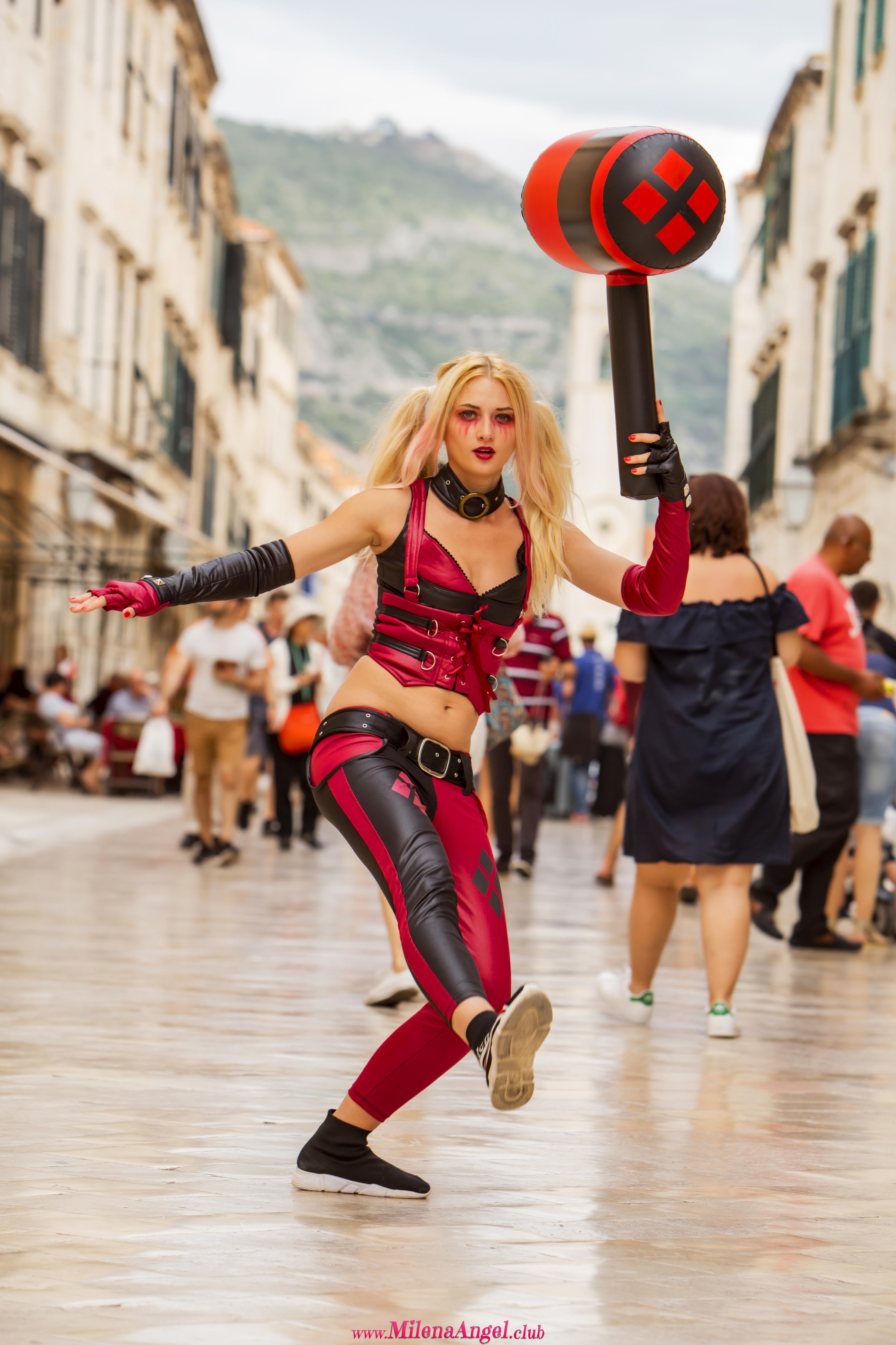 Adventurous blondie attractively poses through the city while wearing Harley Quinn costume  in Milena Angel set HQ Candid