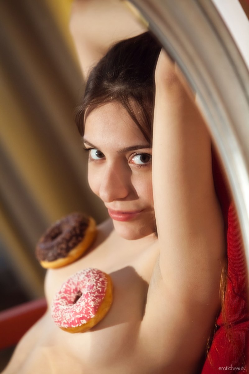 Adorable Maxima eats donuts and shows off her tight ass and trimmed pussy  in Erotic Beauty set Presenting Maxima