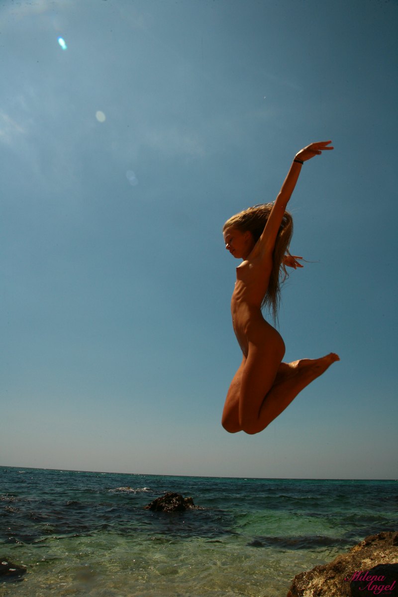 Curly haired brunette Milena looks so good while she is posing naked like that  in Milena Angel set Mermaid