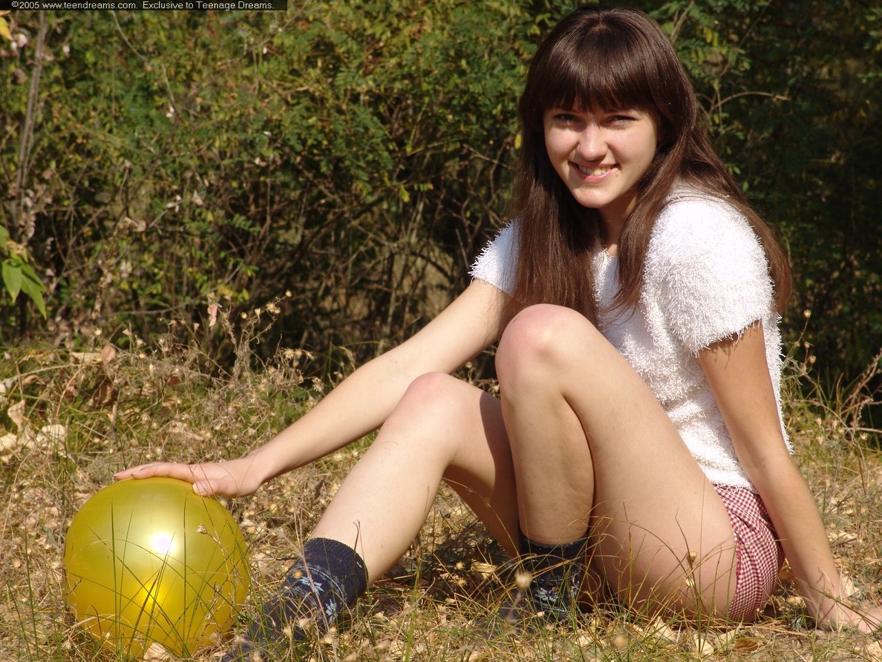 Outdoor girl Juliya plays in the field