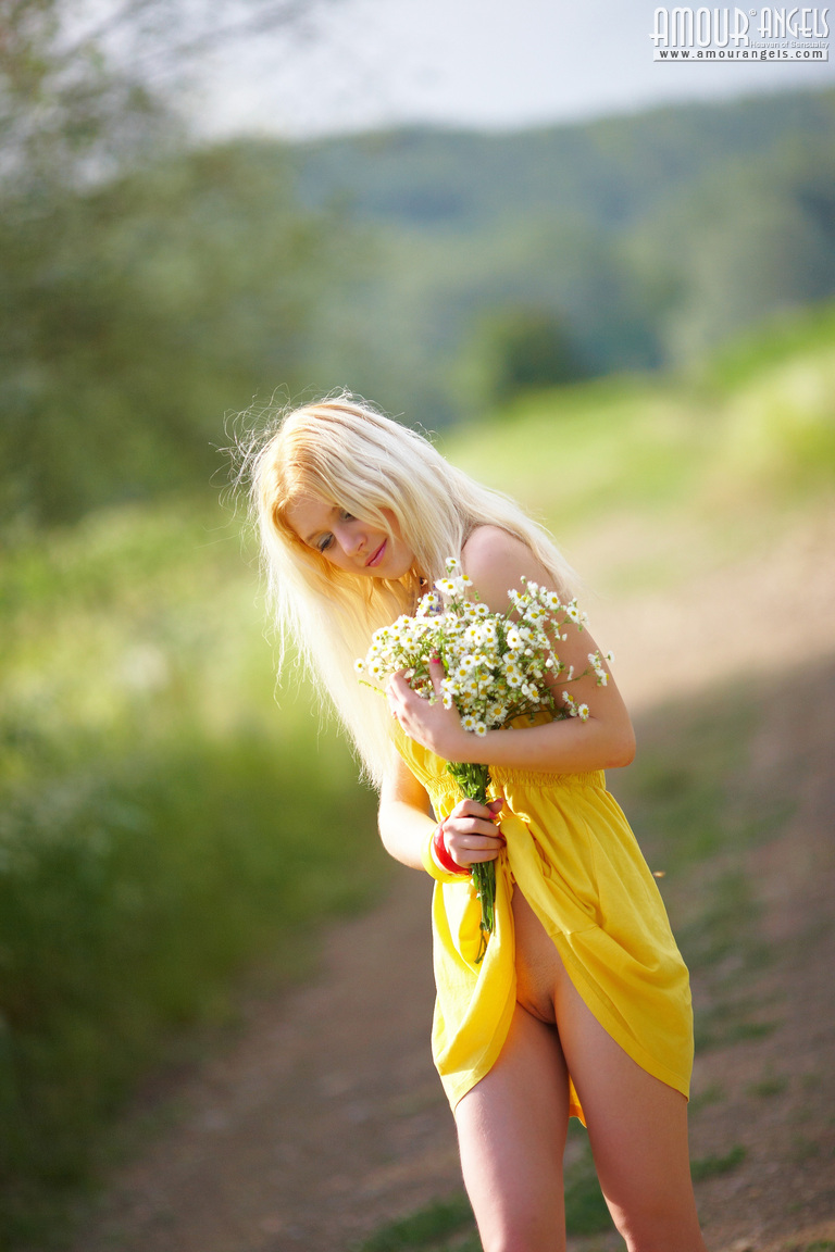 Alina starts with posing in yellow dress then gets rid of it very willingly  in Amour Angels set Shining