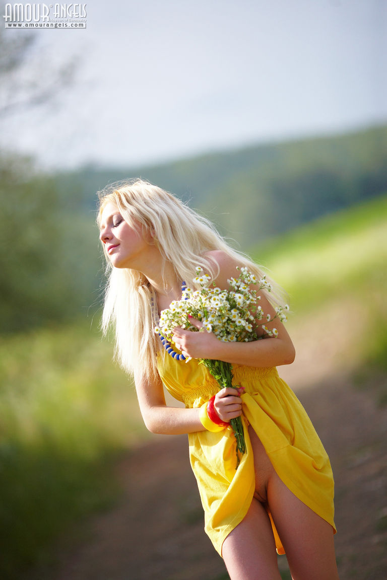 Alina starts with posing in yellow dress then gets rid of it very willingly  in Amour Angels set Shining