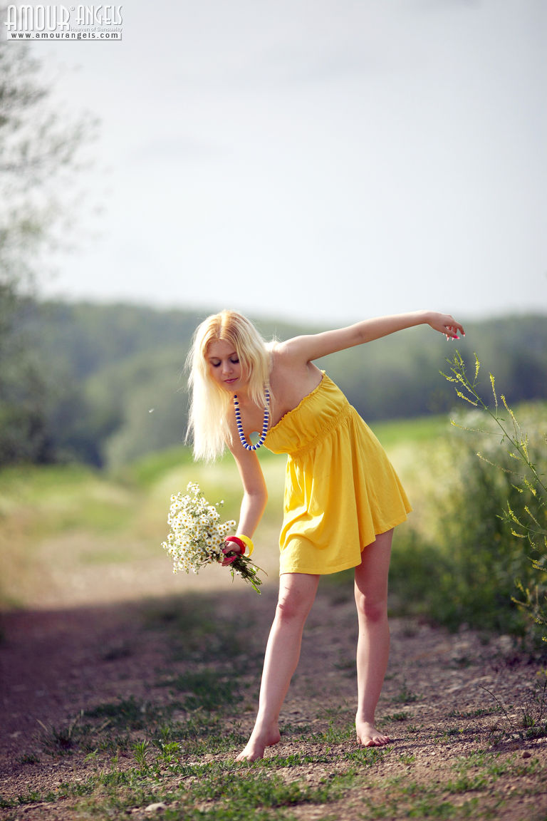 Alina starts with posing in yellow dress then gets rid of it very willingly  in Amour Angels set Shining