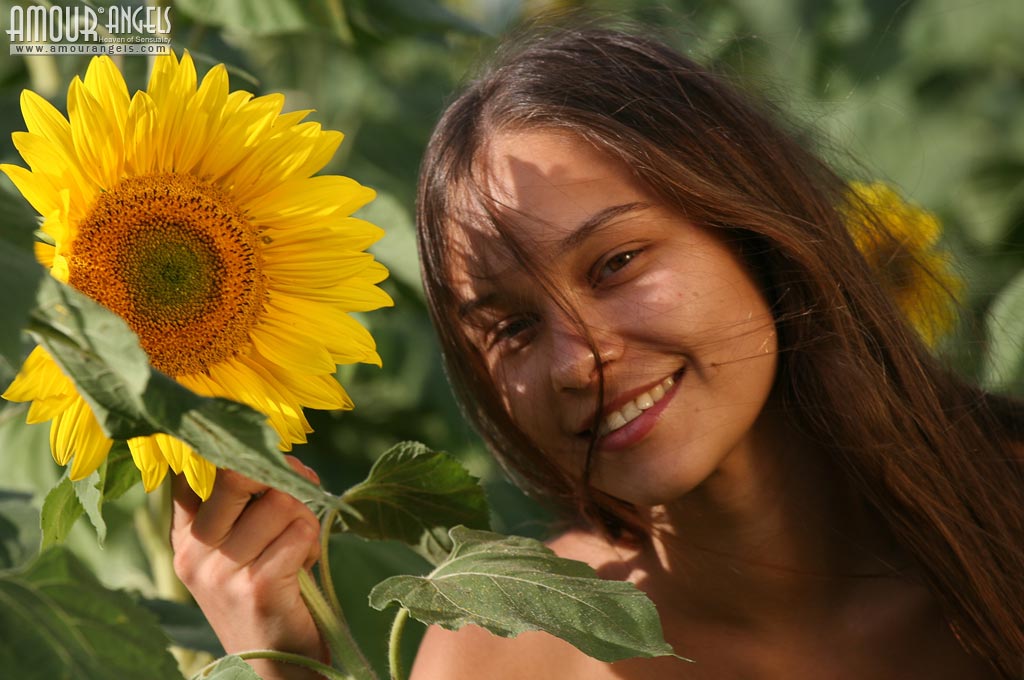 Hottie with a hot tight body and nice breasts Olga having fun among sunflowers  in Amour Angels set Sunflowers