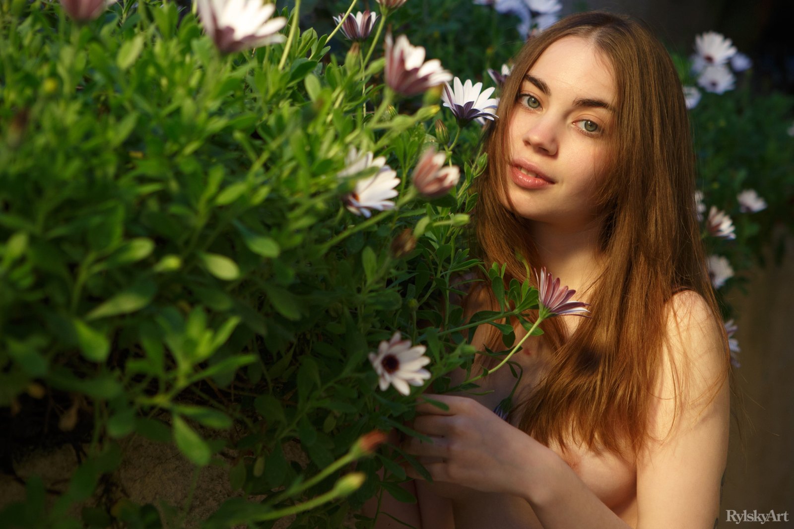 Blooming young beauty sensually poses by the flowers showing off her delightful nubile body  in Rylsky Art set LoveK