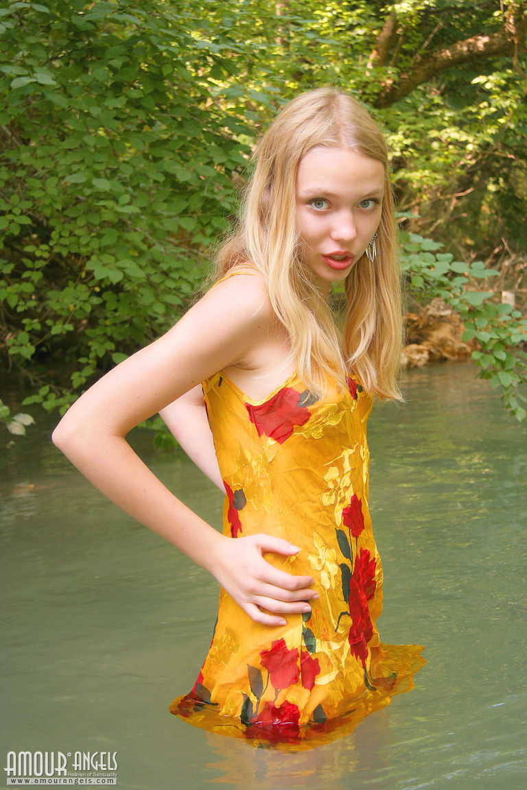 Polly feels like a fish in water while she poses in the cold river in the forest  in Amour Angels set Virgin Polly