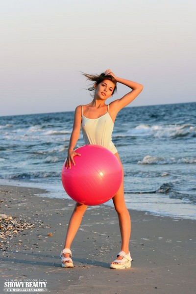 Amazing young brunette looking so good while she is doing beach fitness naked  in Showy Beauty set Beach Fitness 1