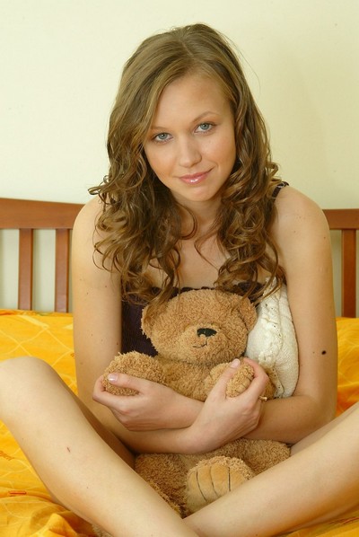 Cute Ukrainian teen poses on her bed